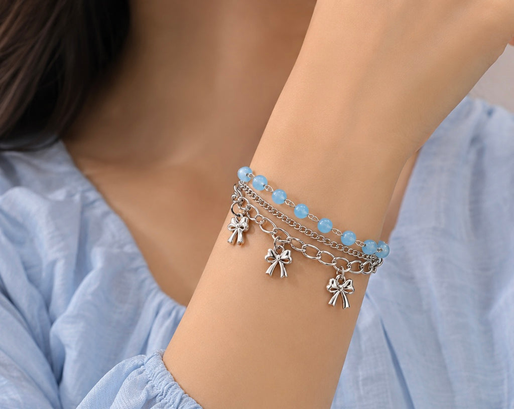 Coquette-inspired multi-layered charm bracelet
