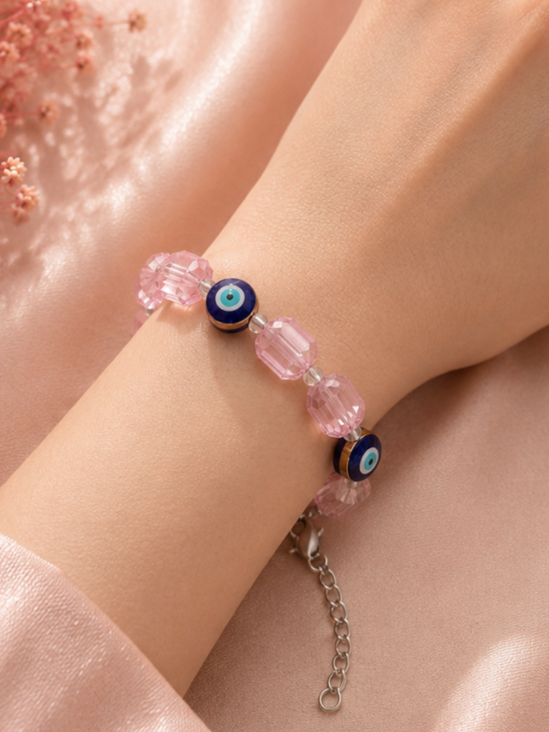 Iridescent light pink crystal and evil eye bead bracelet