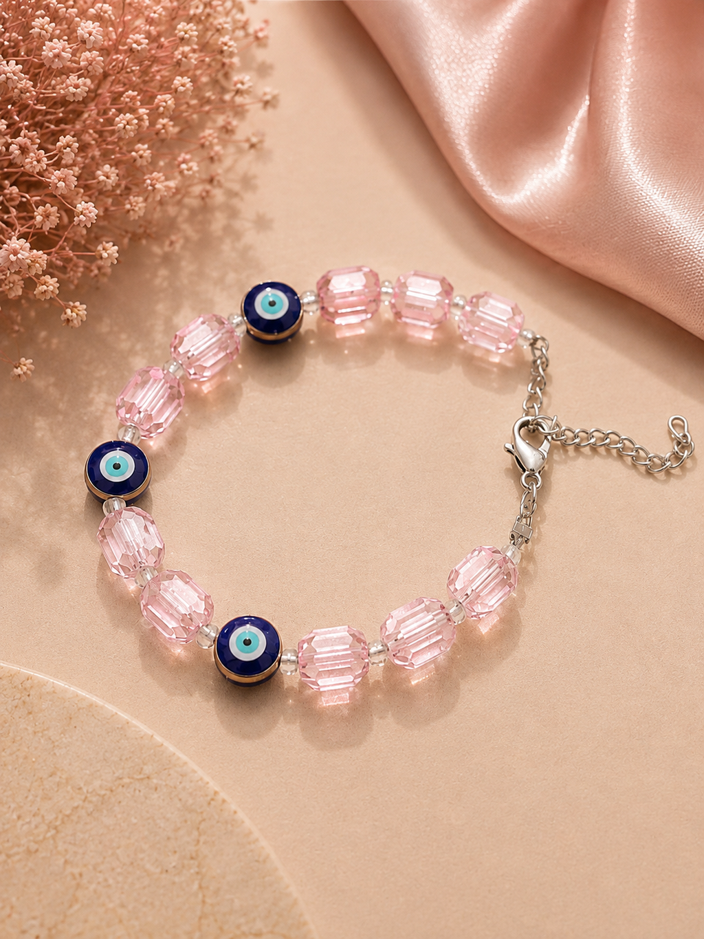 Iridescent light pink crystal and evil eye bead bracelet