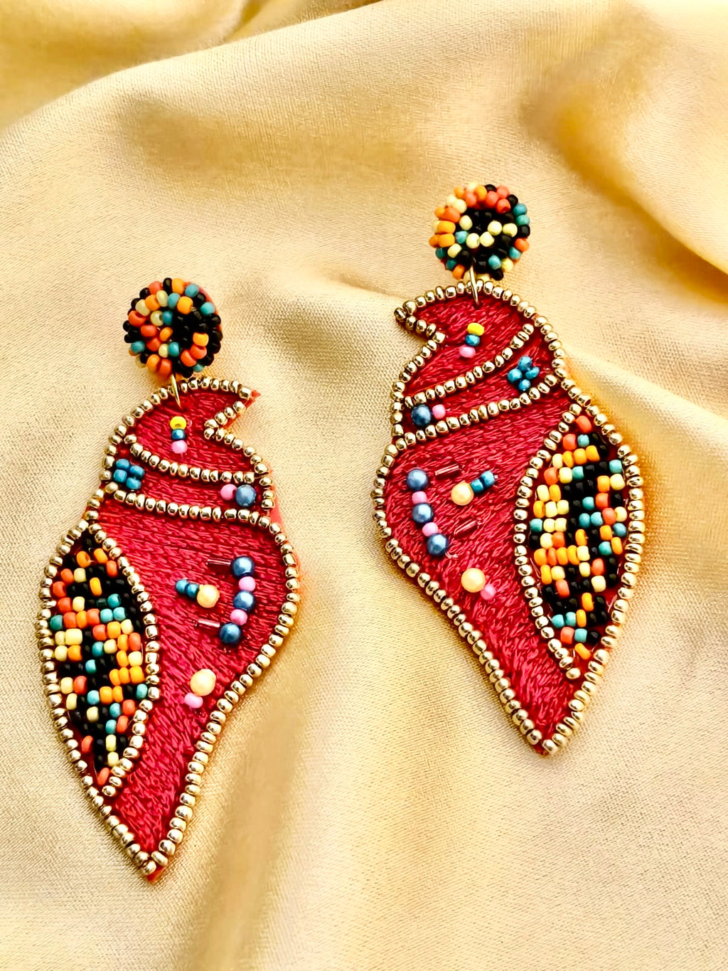 Handmade red Shankh (conch shell) embroidered statement earrings.
