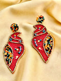 Handmade red Shankh (conch shell) embroidered statement earrings.