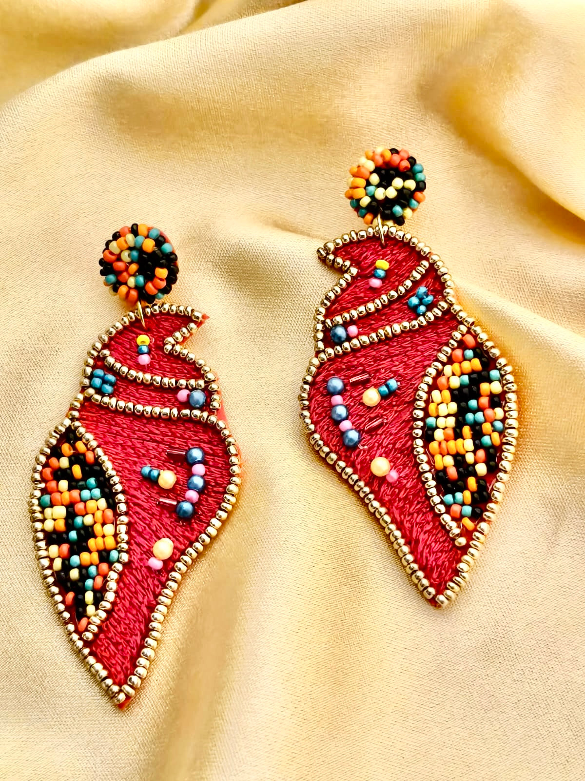Handmade red Shankh (conch shell) embroidered statement earrings.