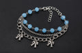 Coquette-inspired multi-layered charm bracelet
