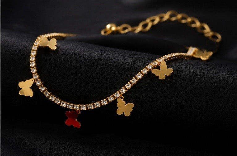 Whimsical gold-plated butterfly tennis charm bracelet