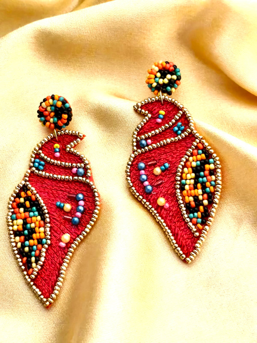 Handmade red Shankh (conch shell) embroidered statement earrings.