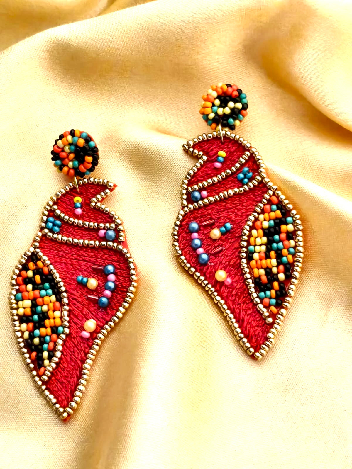 Handmade red Shankh (conch shell) embroidered statement earrings.