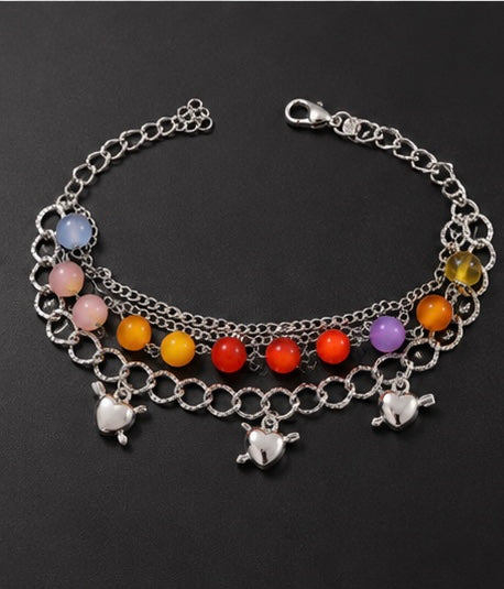 Vibrant multi-layered charm bracelet