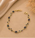 Sapphire blue crystal vine and leaf gold-toned Tulip bracelet