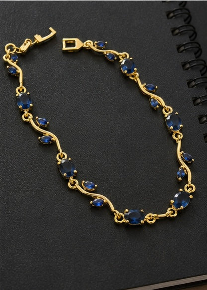 Sapphire blue crystal vine and leaf gold-toned Tulip bracelet