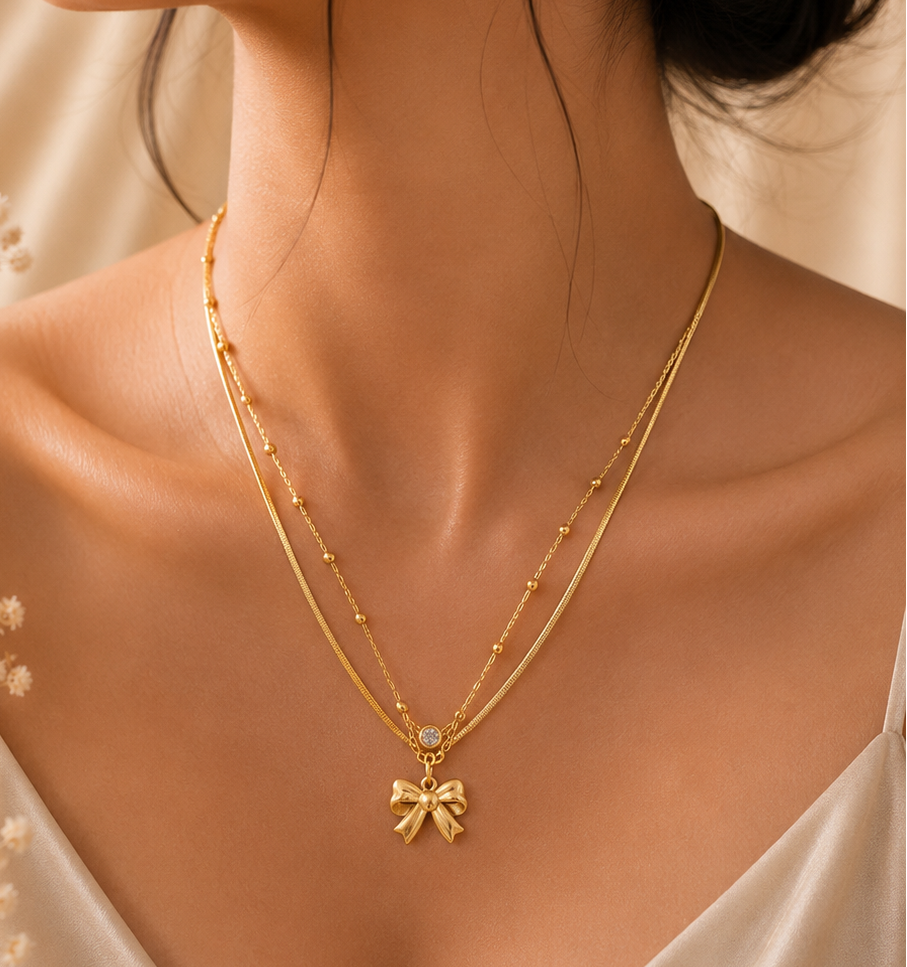 Layered Bow and Beaded Charm Necklace.