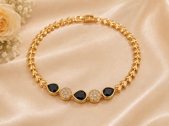 Elegant gold-toned drop shape charm bracelet
