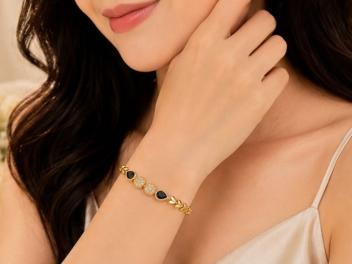 Elegant gold-toned drop shape charm bracelet