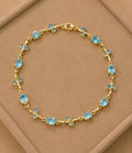 Aquamarine blue crystal vine and leaf gold-toned Tulip bracelet