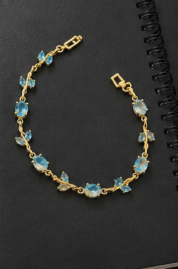 Aquamarine blue crystal vine and leaf gold-toned Tulip bracelet