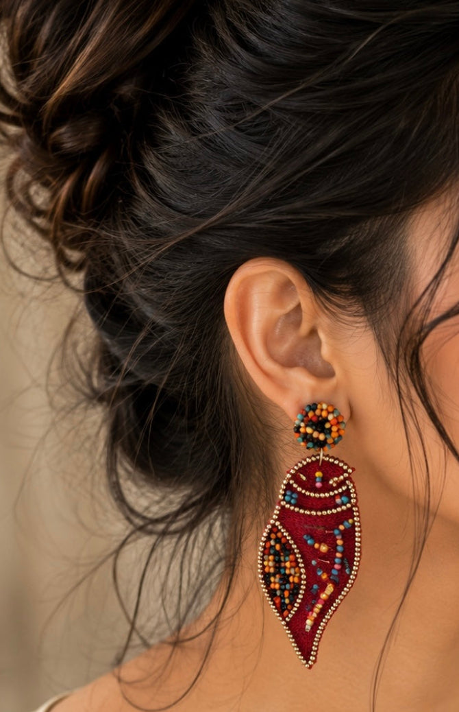 Handmade red Shankh (conch shell) embroidered statement earrings.