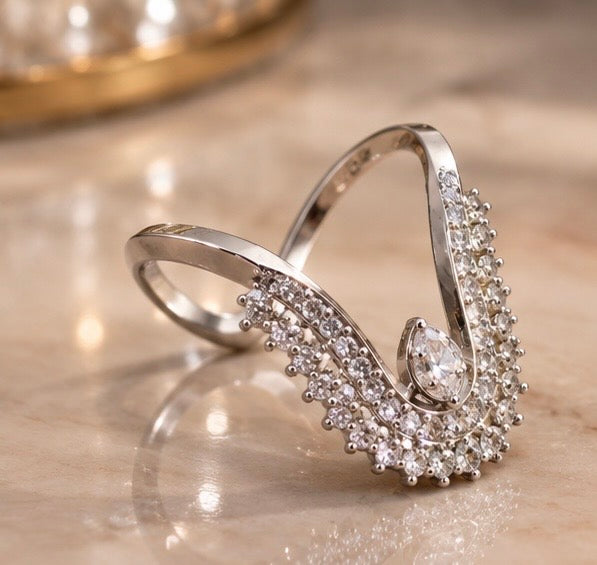 Curved chevron tiara ring