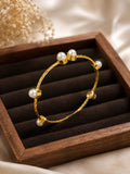 Elegant textured gold interval pearl bangle