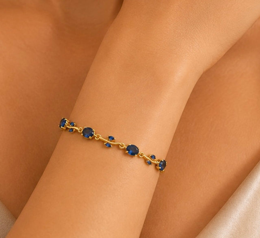 Sapphire blue crystal vine and leaf gold-toned Tulip bracelet