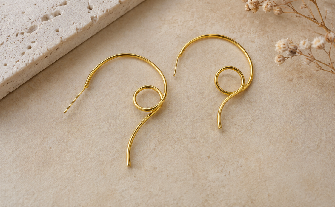 Gold-plated spiral swirl hoop earrings