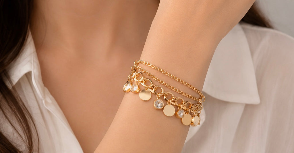 Flat, polished gold-tone circular discs charm bracelet