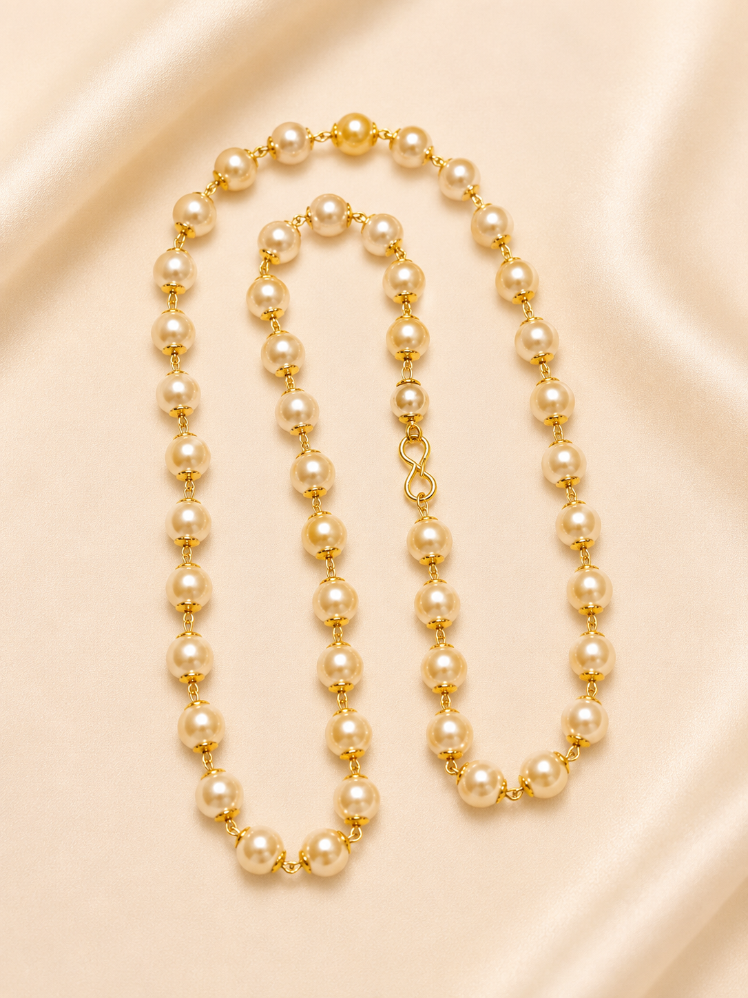 Elegant traditional golden pearl station mala
