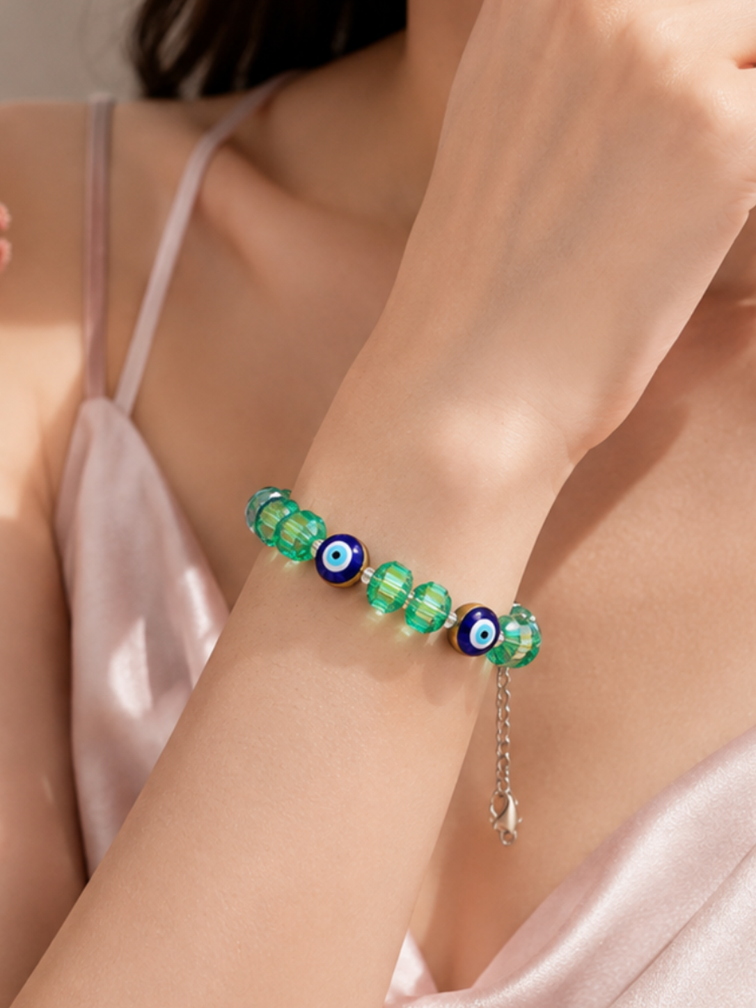 Iridescent green crystal and evil eye bead bracelet