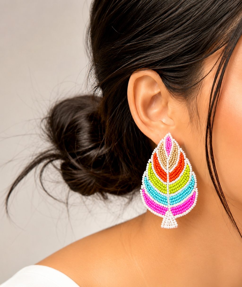 Handmade multi-color palm leaf beaded statement earrings.