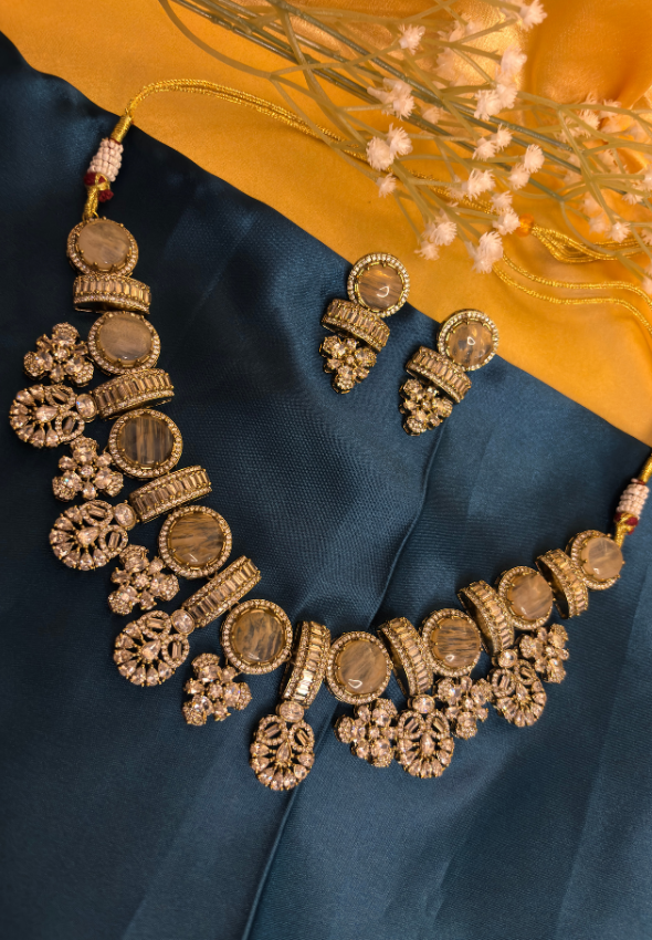 Golden statement piece with doublet stone and AD stone work