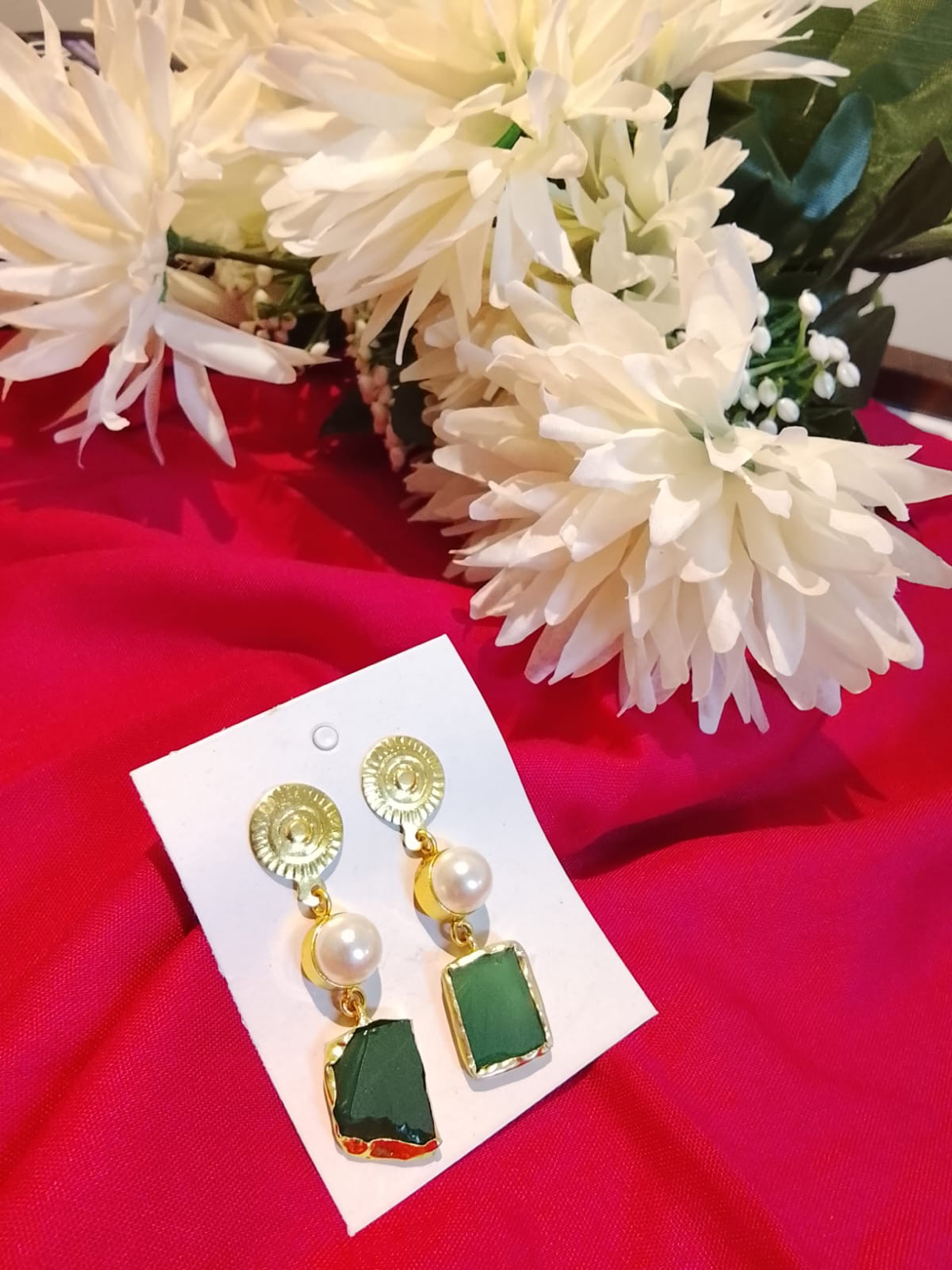 Brass pearl earring with uncut green stone