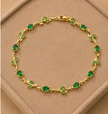 Emerald green crystal vine and leaf gold-toned Tulip bracelet