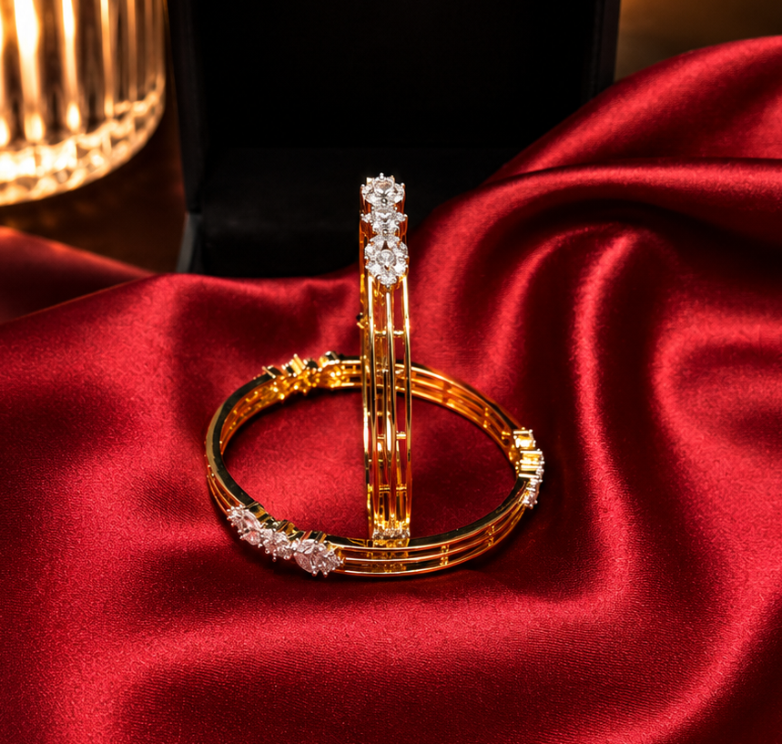 Alluring pair of gold-plated triple-strand American Diamond bangles