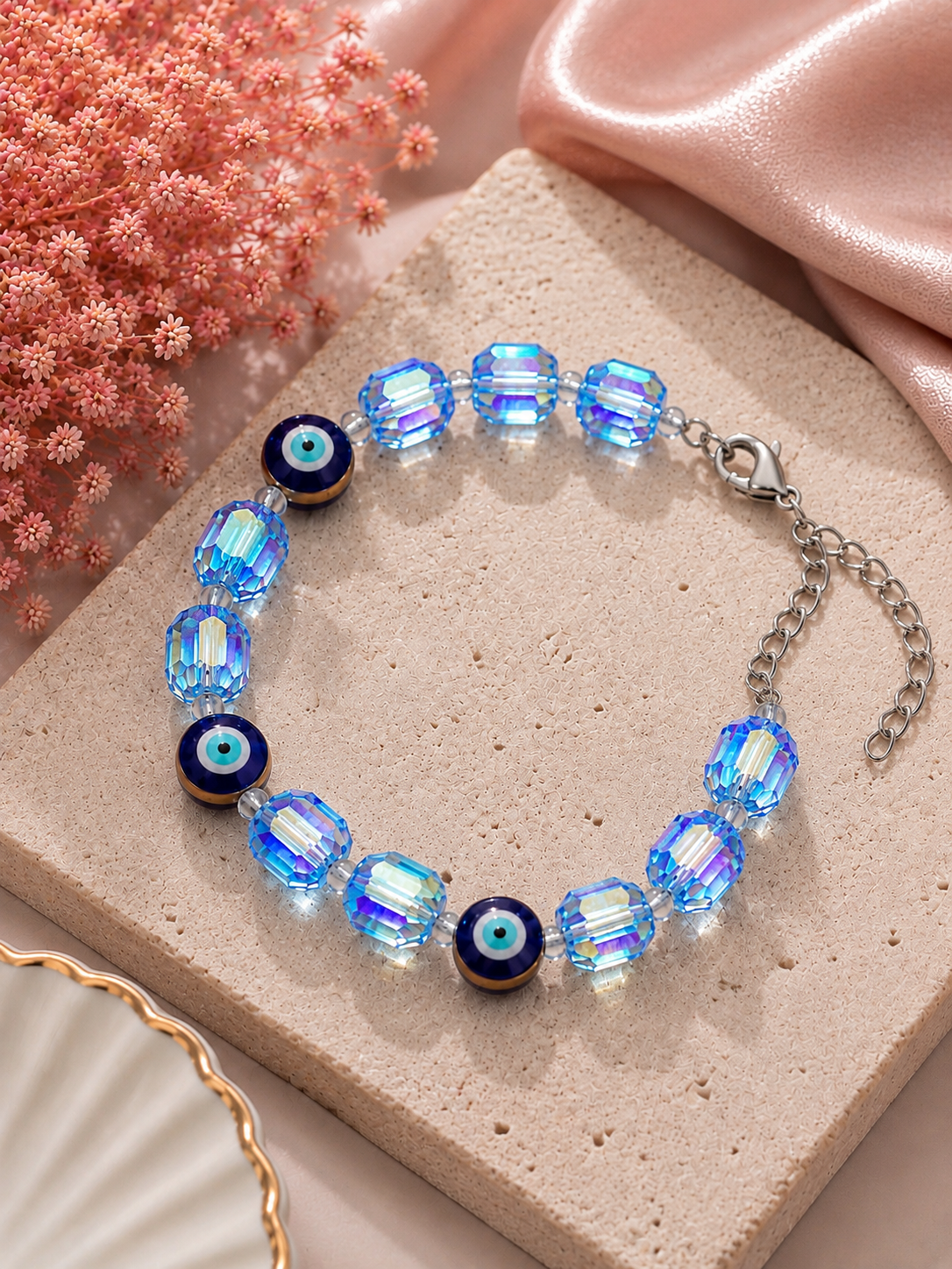 Iridescent light blue crystal and evil eye bead bracelet