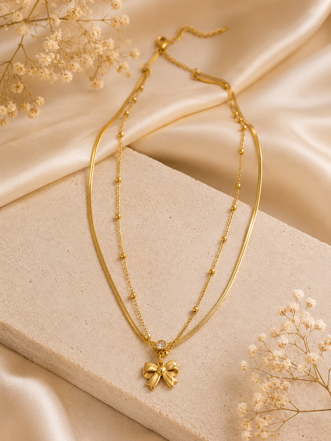 Layered Bow and Beaded Charm Necklace.