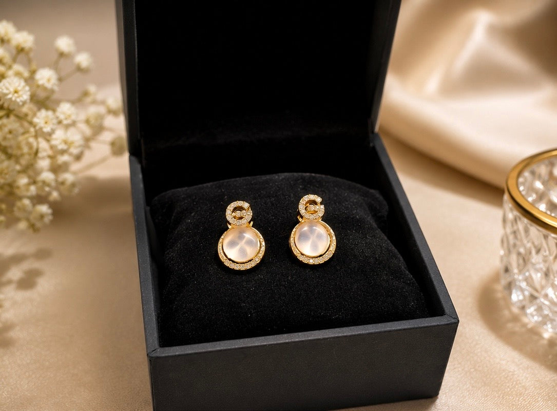 Korean-style "G-letter" opal studs