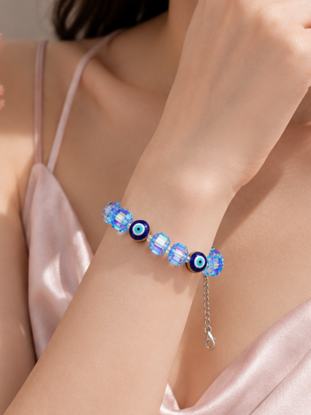 Iridescent light blue crystal and evil eye bead bracelet