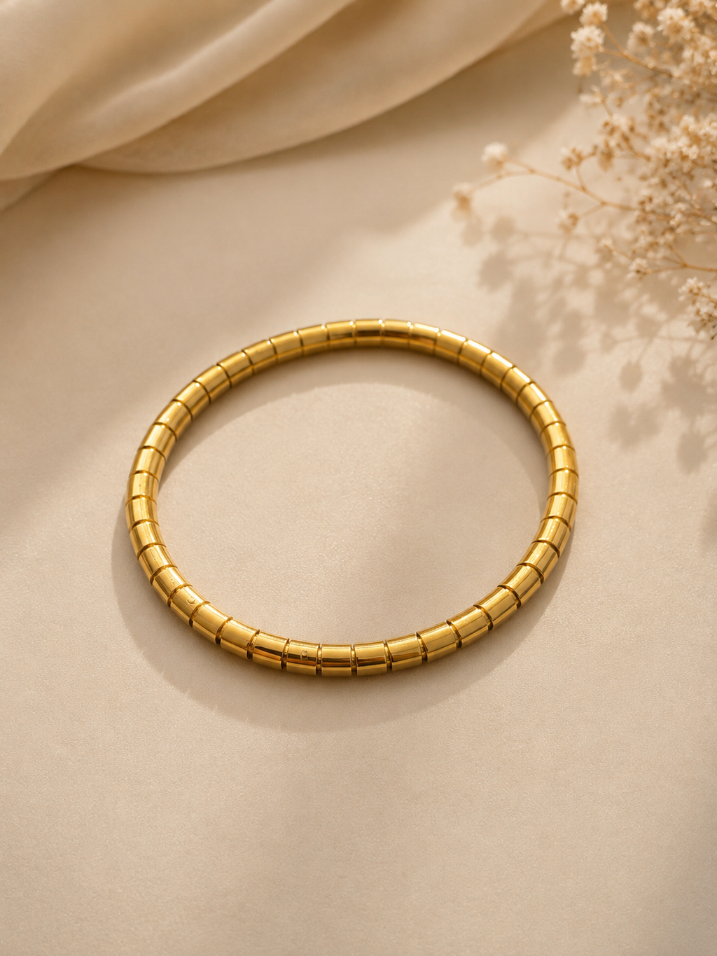 Minimalist gold-toned segmented kada bracelet