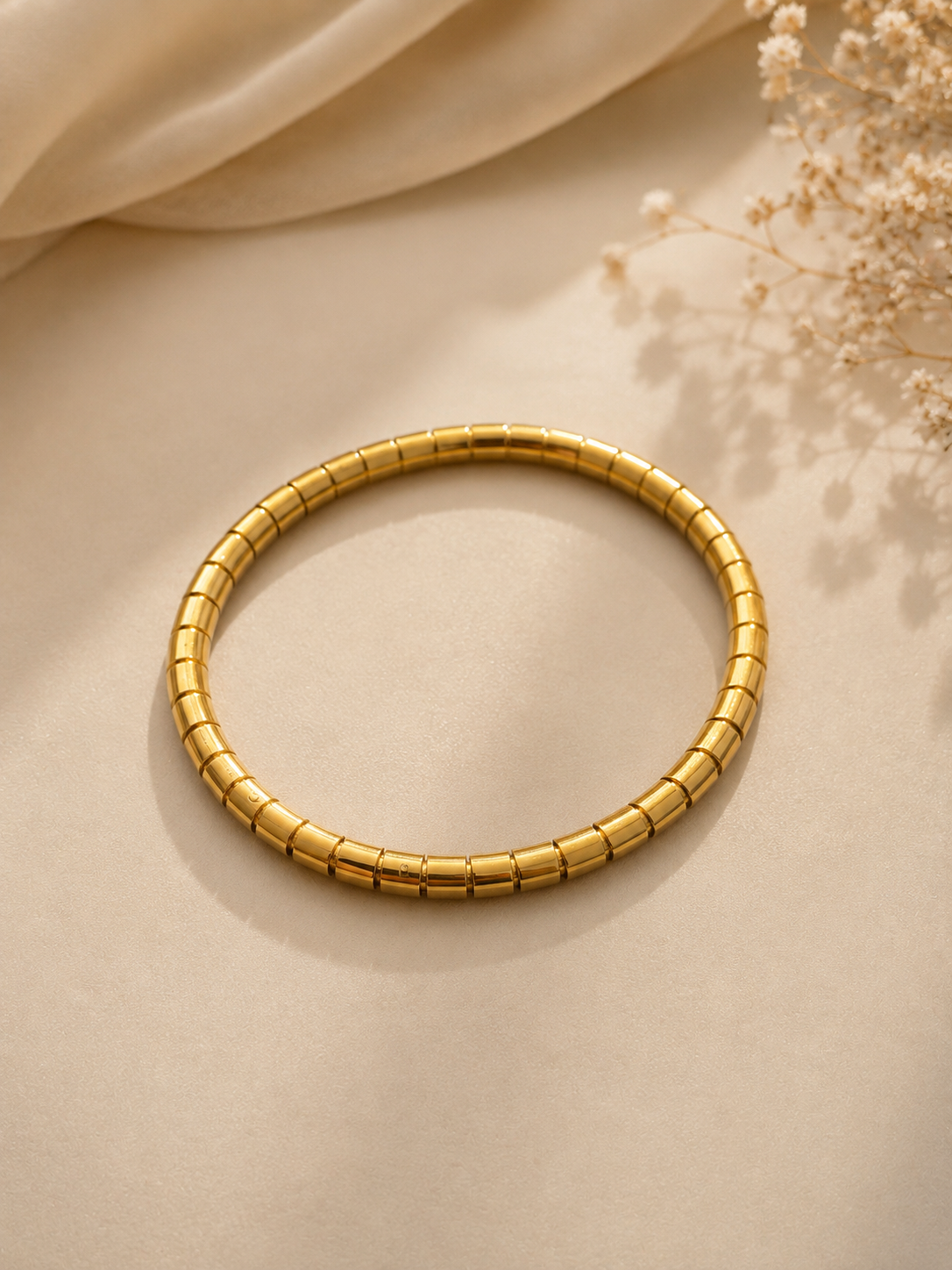 Minimalist gold-toned segmented kada bracelet