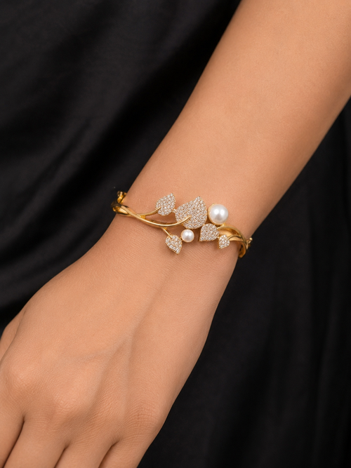 AD exquisite botanical-themed pearl and diamond statement kada bracelet,