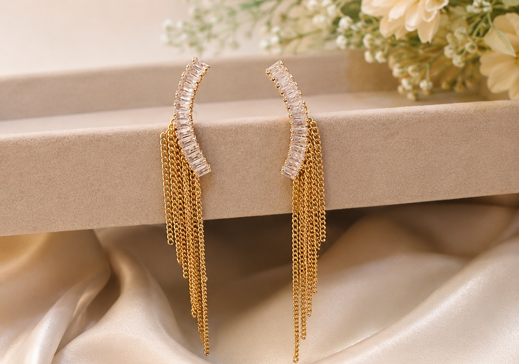 Women's gold crystal ear climber chain tassel drop earrings.