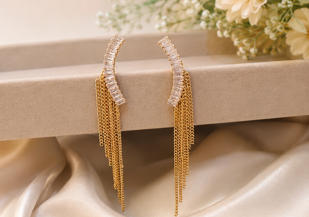 Women's gold crystal ear climber chain tassel drop earrings.