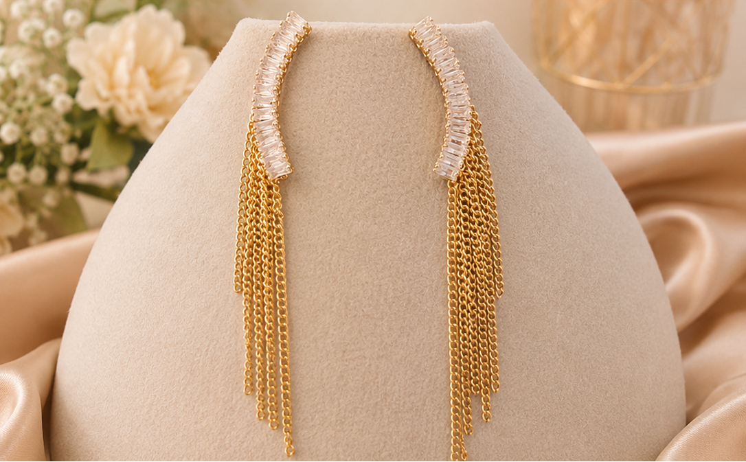 Women's gold crystal ear climber chain tassel drop earrings.