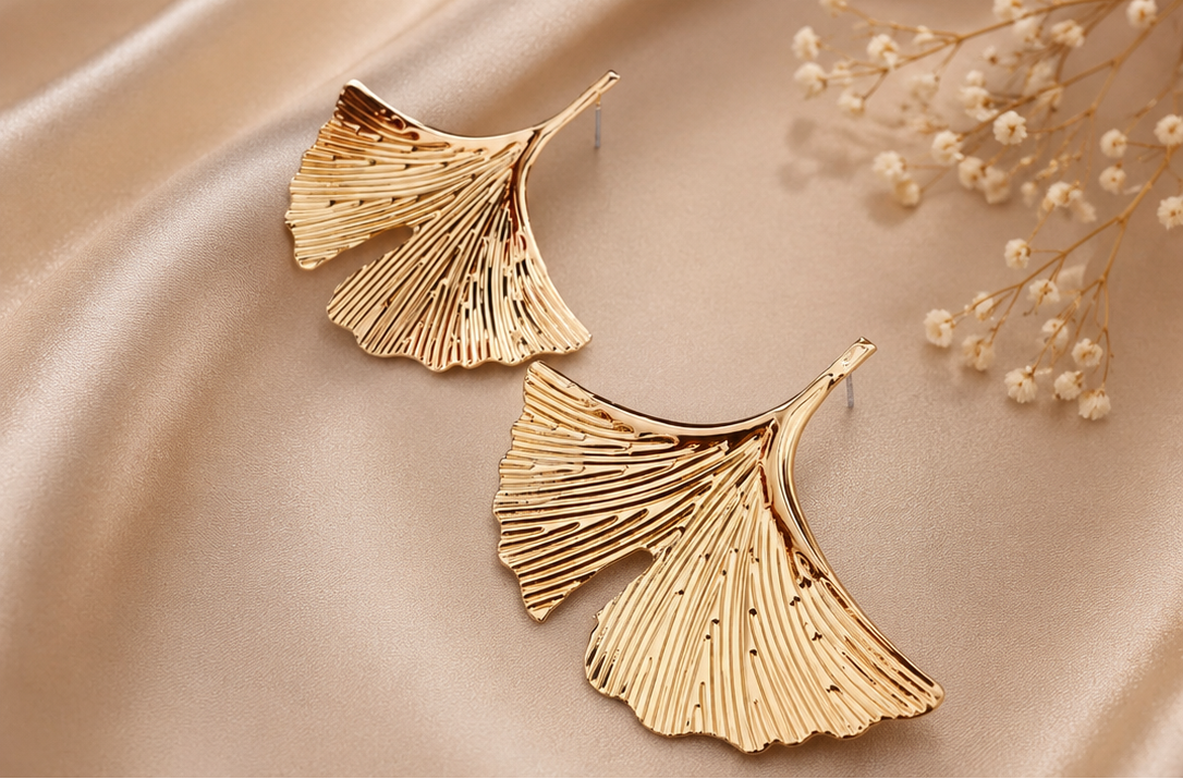 Women's botanical gold ginkgo leaf statement stud earrings