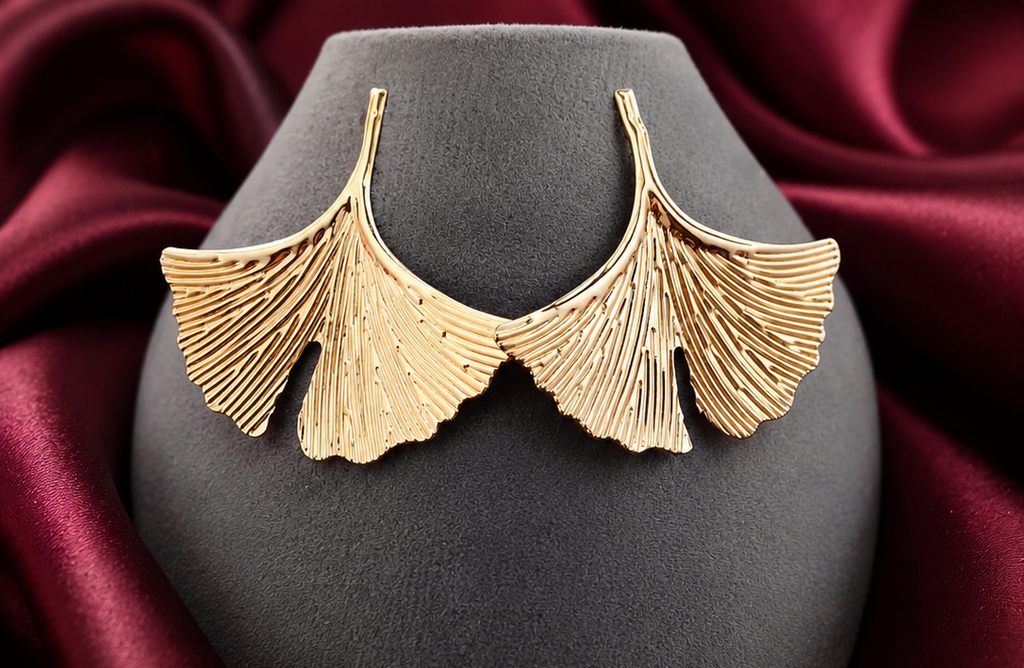 Women's botanical gold ginkgo leaf statement stud earrings