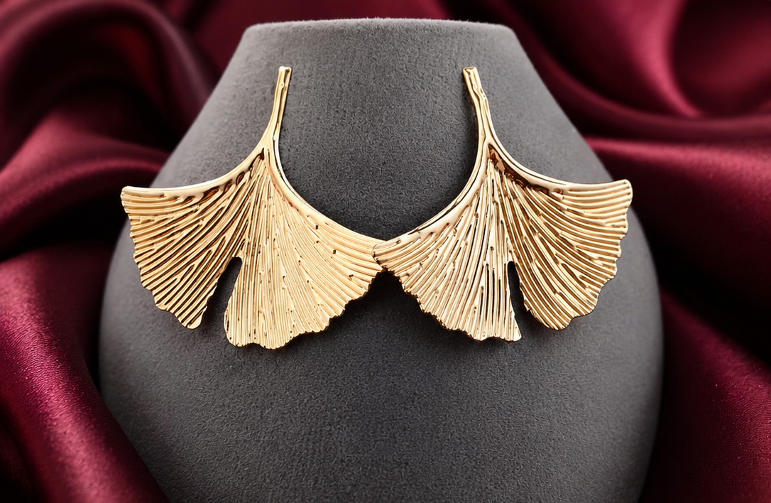 Women's botanical gold ginkgo leaf statement stud earrings