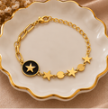 Black enamel star mixed-link charm bracelet