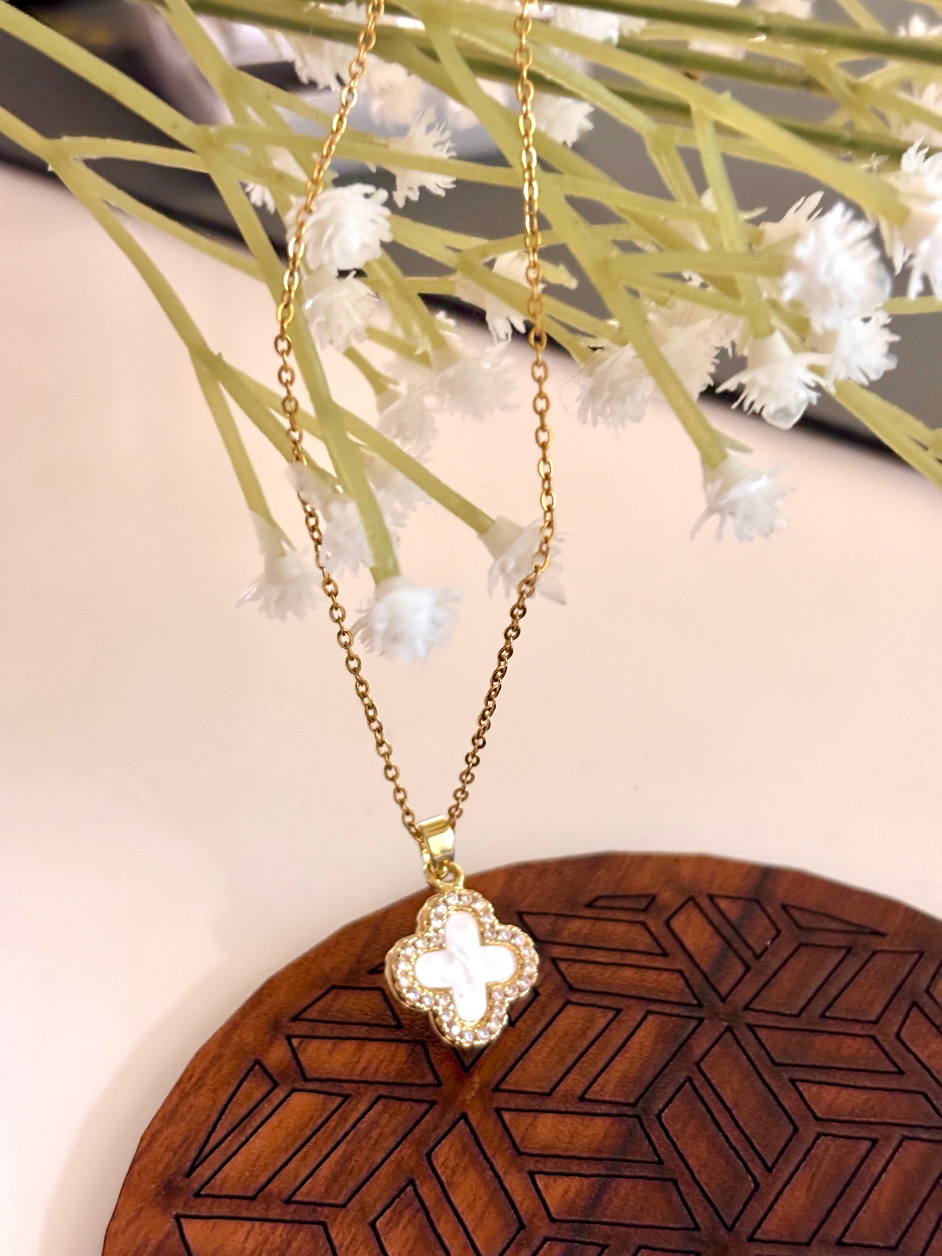 Dainty White And Black Clover Necklace in Gold Plating.