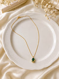 Gold-plated faux emerald teardrop pendant necklace