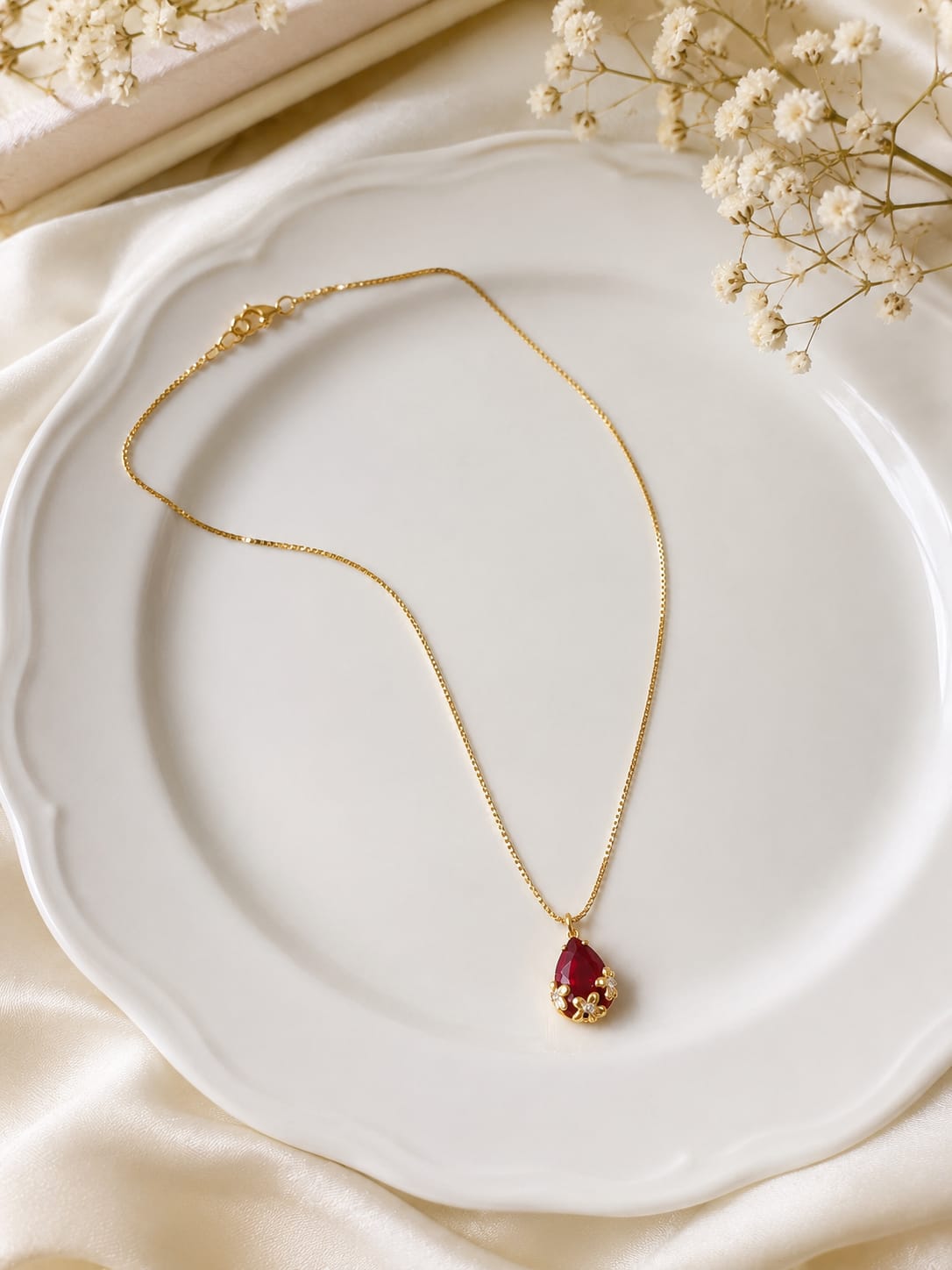 Gold-plated faux emerald teardrop pendant necklace