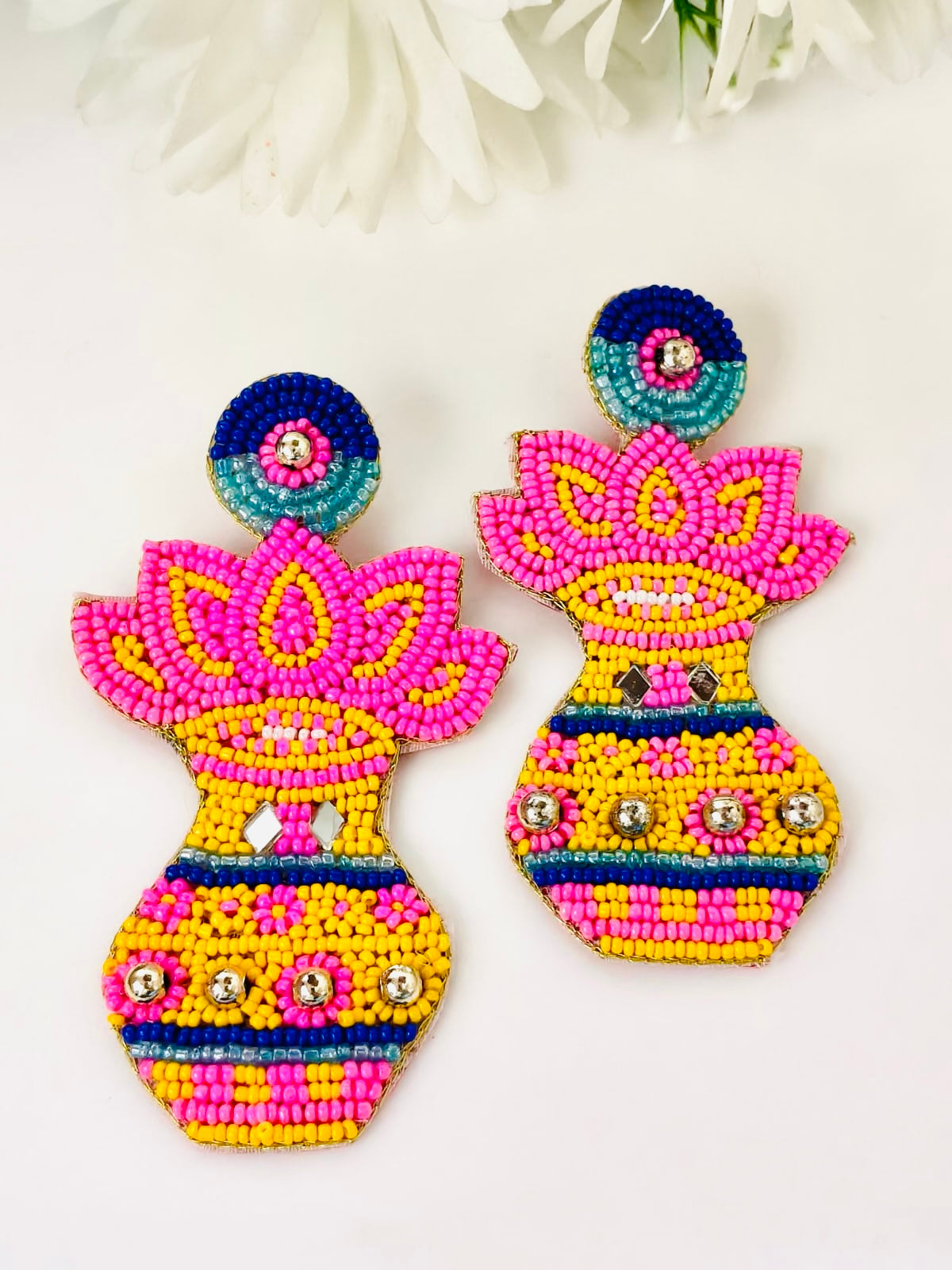Handmade Kalash and lotus beaded statement earrings.