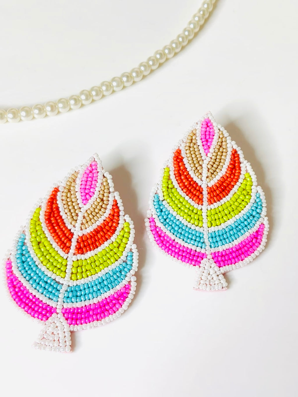 Handmade multi-color palm leaf beaded statement earrings.